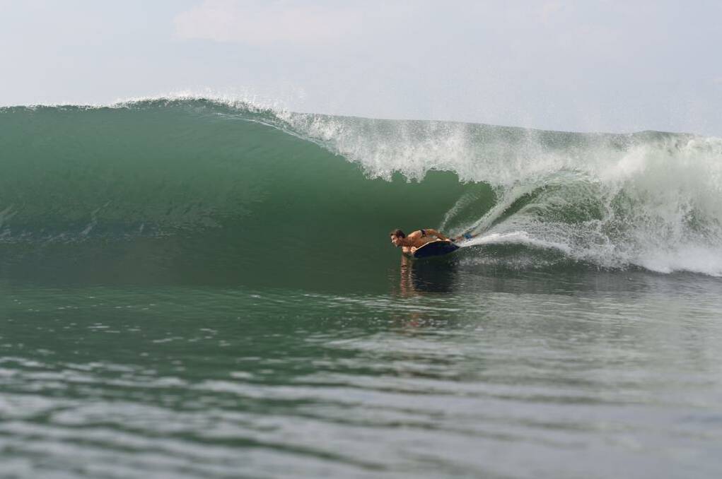 PORT MACQUARIE TEACHING SESSION: Ryan Hardy riding along a wave. Photo: Bali Bodyboarding