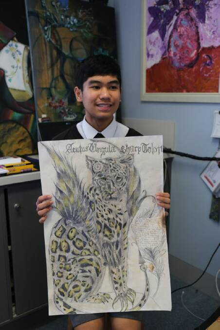 YOUNG ARTIST: Heo Ignacio with his artwork Mechanimal. Photo: St Joseph's Regional College.