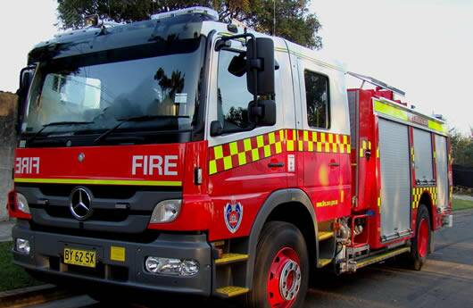 On fire: Local firefighters have been called to a reported burning vehicle in Port Macquarie.