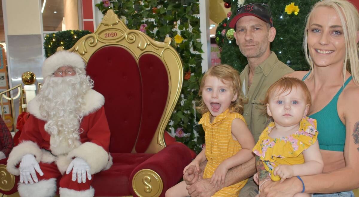 CHRISTMAS APPROACHES: Santa with Heath Ewart, Karma, Azaliah and Sarah Lee.