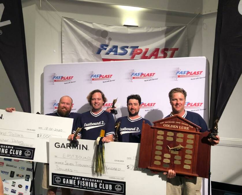 WINNERS: Crew of Eastbound with their prizes and trophy. Photo: Port Macquarie Game Fishing Club.