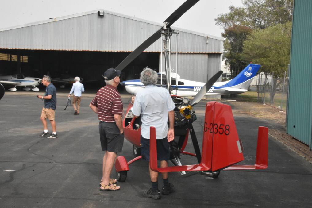 WHAT'S ALL THE FUSS: Hastings District Flying Club members examine the rotors.