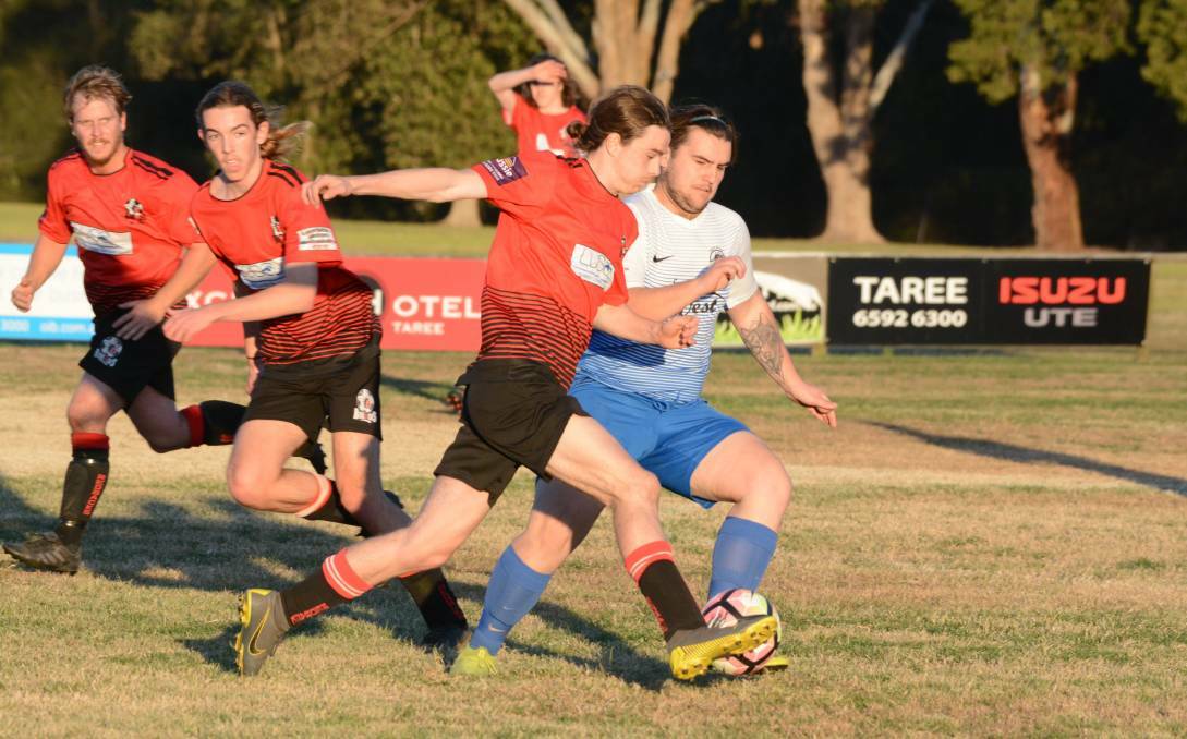 REDBACKS: Dan Adelt and Dylan Webber playing in the Football Mid North Coast Premier League during July 2019.