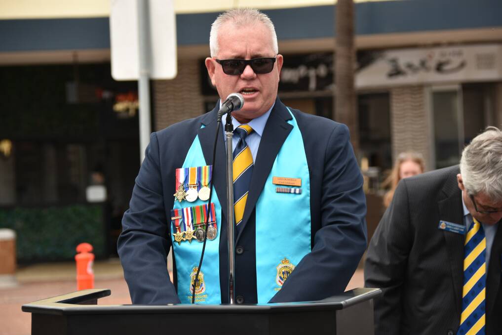 OFFICIAL DUTIES: Chaplain Ged Oldfield speaking at the 2020 Bangka Island massacre commemoration service in February.