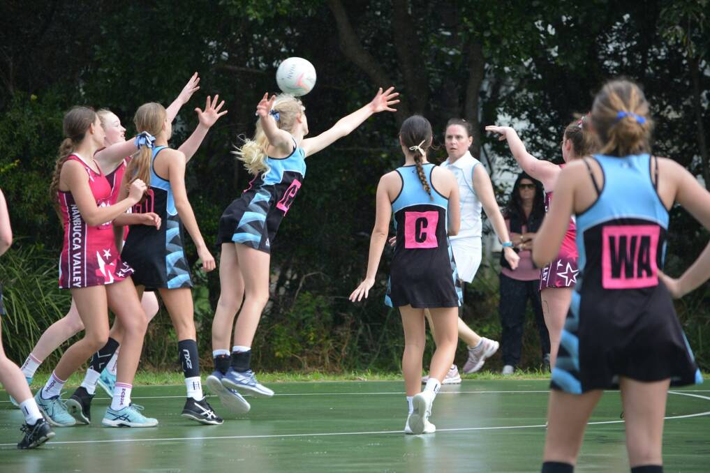 ON THE BALL: Hastings Valley netballers playing off against Nambucca Valley at the competition. Photo: Hastings Valley Netball Association.