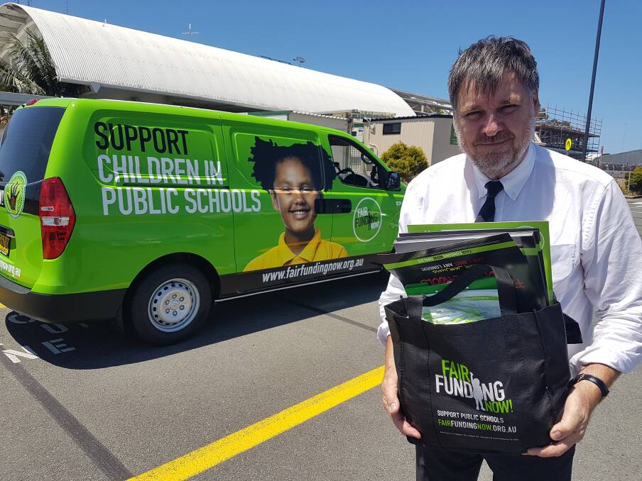 On the road again: Former principal and NSW Teachers Federation president Maurie Mulheron with goodies for the Fair Funding campaign.