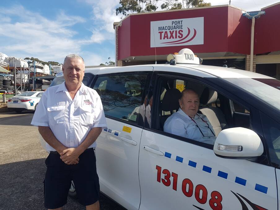Warning please: Port Taxis Fleet manager Carl Eade and driver Peter Brasher.