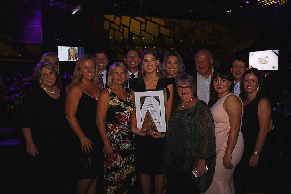 NATIONAL WINNER: Port Macquarie student Arcadia Meldrum with supports at the national awards. Photo: Supplied/Newman College.