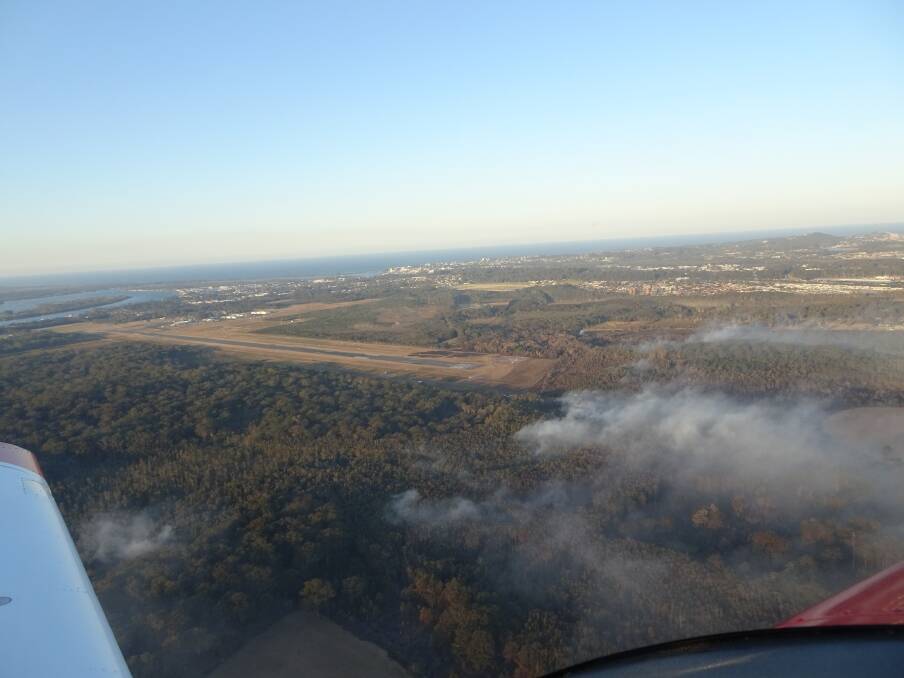 FROM THE AIR: The bush fire in Port Macquarie. Photo: Stephan Tessede.