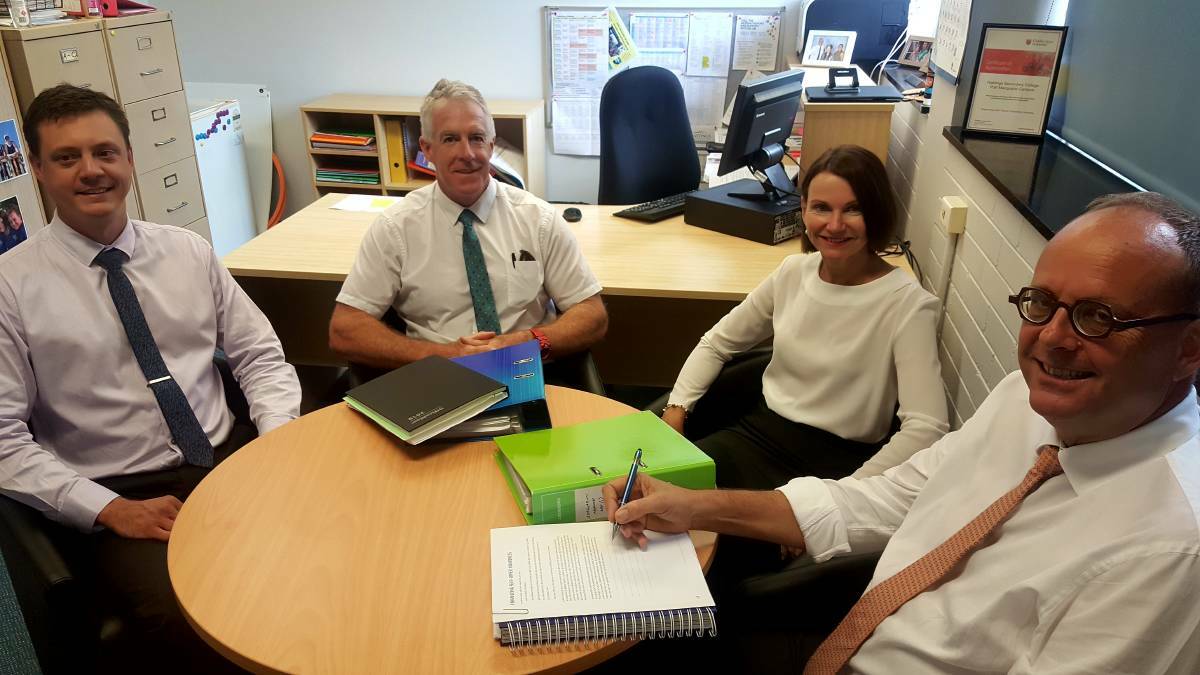 NEW ERA: Andrew Kuchling director, educational leadership, Geoffrey Duck, deputy principal, Meaghan Cook, incoming principal and Willem Holvast, Hastings Secondary College executive principal talk about a new era at the Port Macquarie campus in April 2019. PHOTO: Laura Telford.