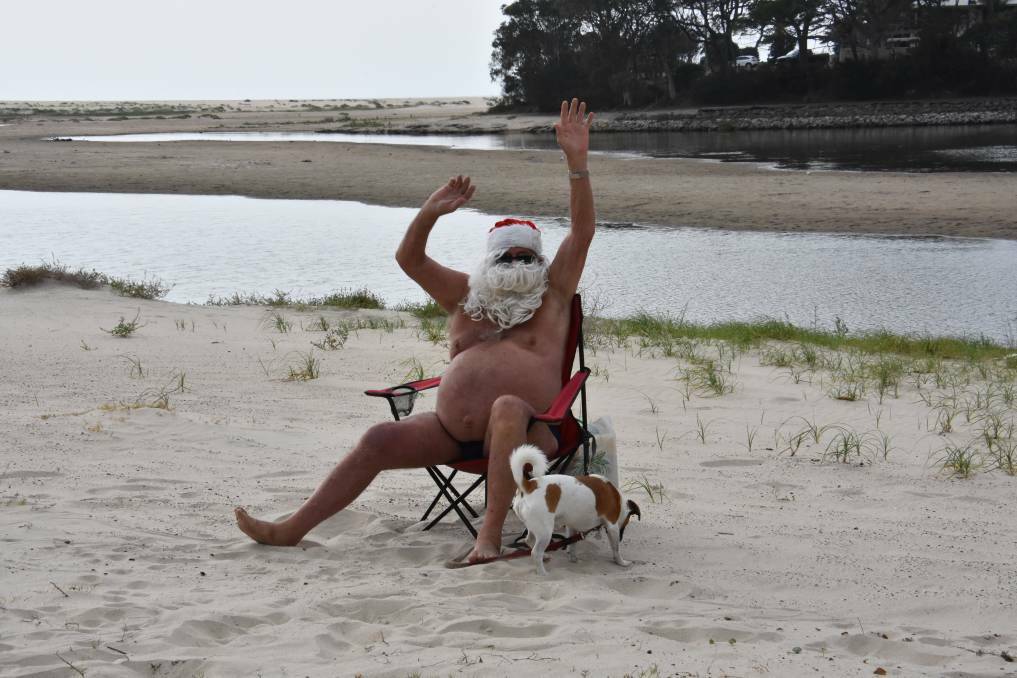 Special wishes: Santa Ron Hunter from his deck chair at Lake Cathie in 2019. 