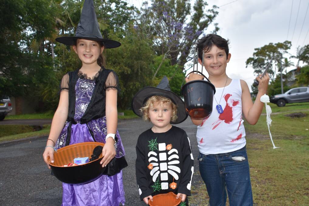 TRICK-OR-TREAT: Port Macquarie youngsters Lilly McKern and Oscar McKern (right) with Amelia Waller-Shaw (centre).