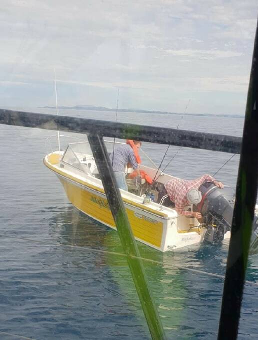 Out on the water: Marine Rescue pull alongside the boat. Photo: Marine Rescue Port Macquarie/social media.