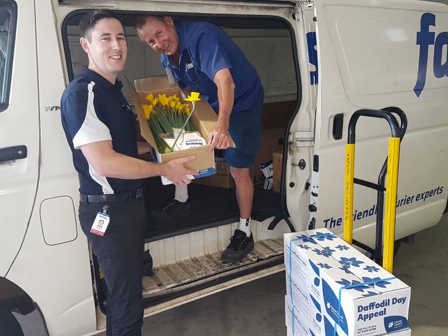Daffodil delivery: General manager Michael Wynter and courier franchisee Scott Marks.
