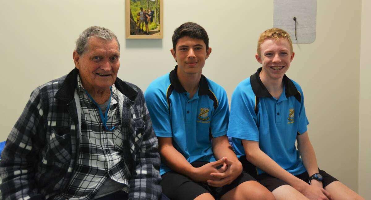 Connecting: Mount Carmel House resident Peter Cook with MacKillop College students Elliott Worner and Tana Marino.