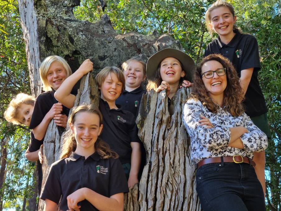 Nature-based learning: The Nature School's head of primary Catherine Oehlman with Year 5 students. Photo: Supplied
