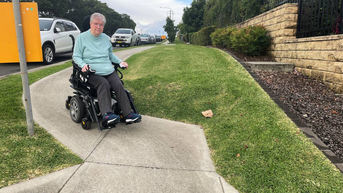 Garden Village resident Carolyn Churchill said the steep slope and curve of the footpath makes it difficult for her to use it with her chair. Photo: Ruby Pascoe