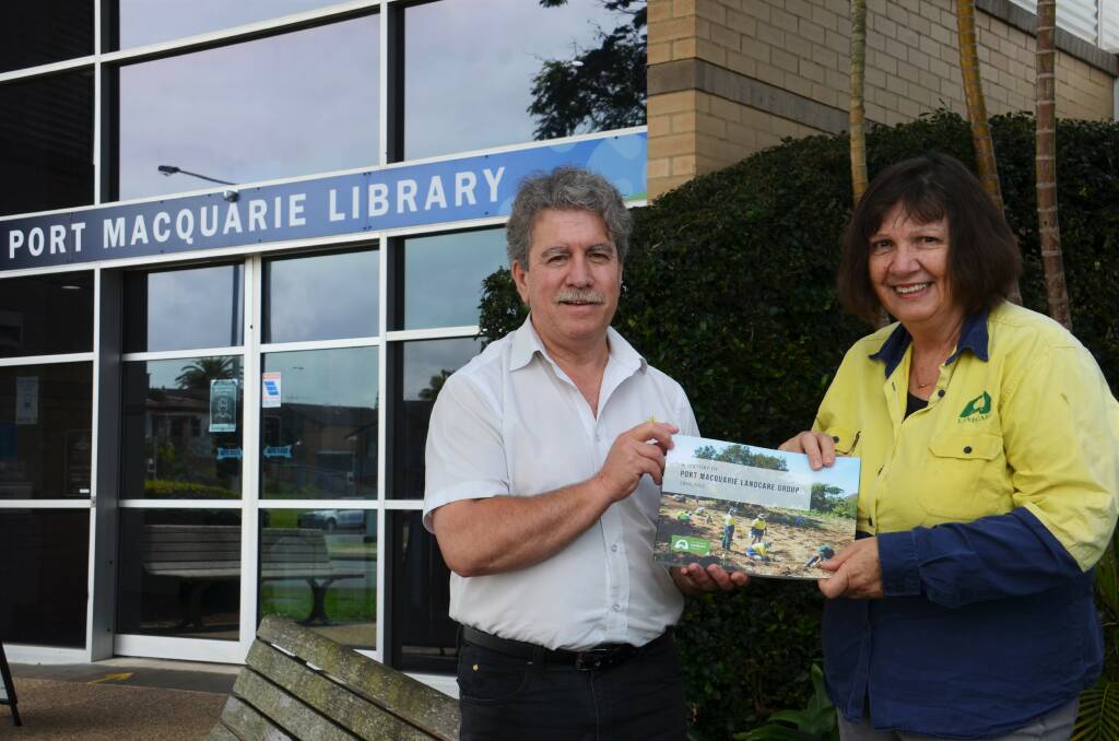 Port Macquarie Library reference services librarian Jeff Stonehouse with Port Macquarie Landcare Group volunteer Joan Wilson. Photo: Ruby Pascoe