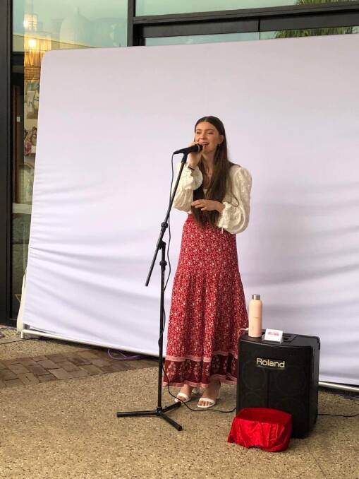 Charlotte has been busking in Port Macquarie since she was seven. Photo supplied