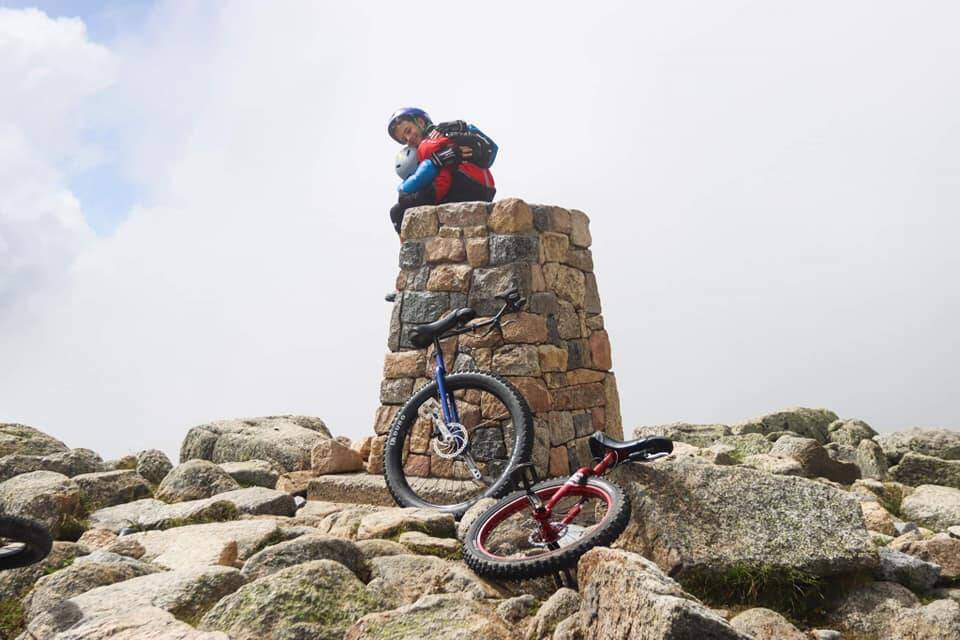 Oliver at the summit after averaging 25 kilometres for 12 days on his unicycle. Photo supplied by Lloyd Godson