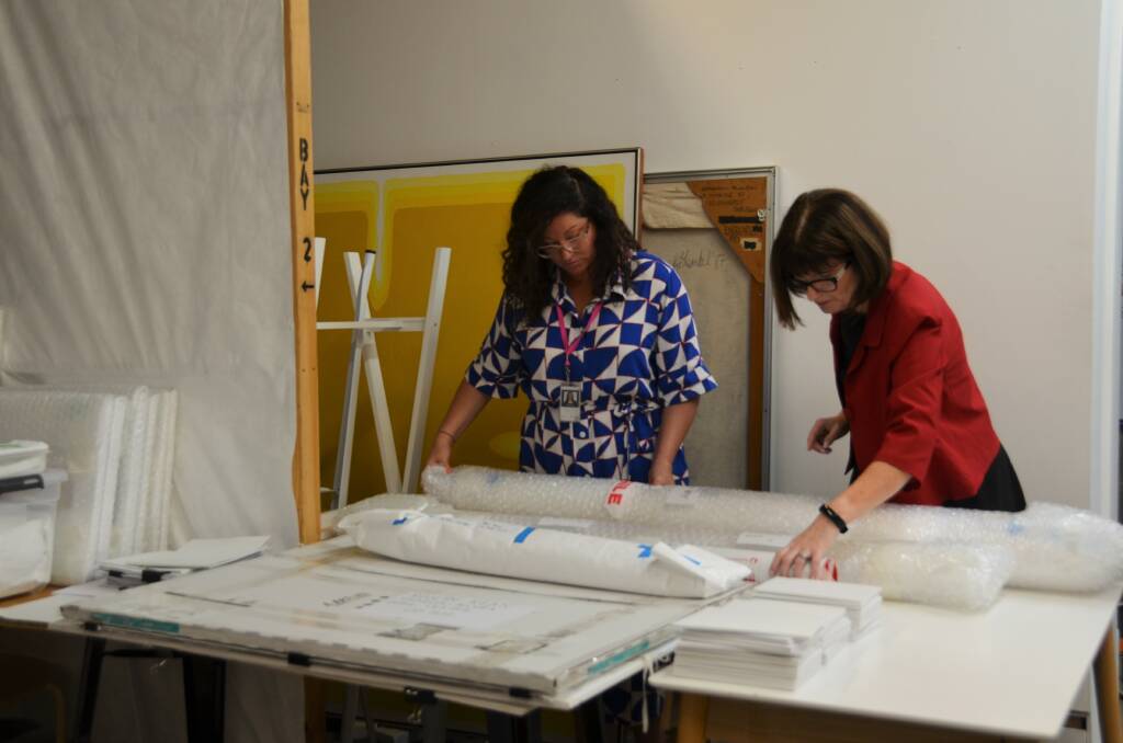 Regional Gallery Curator Bridget Purtill and Glasshouse Venue Manager Pam Milne check the artwork saved during February's storm. Picture by Ruby Pascoe