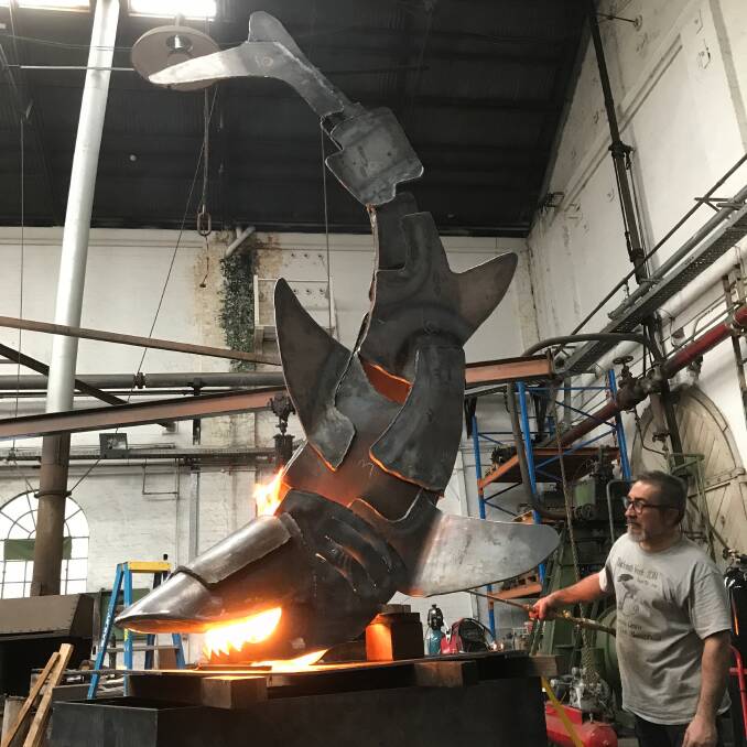 Art in action: Internationally renowned artist, designer, and teacher Roberto Giordani works on The Decomporsi sculpture. Photo: Port Macquarie-Hastings Council