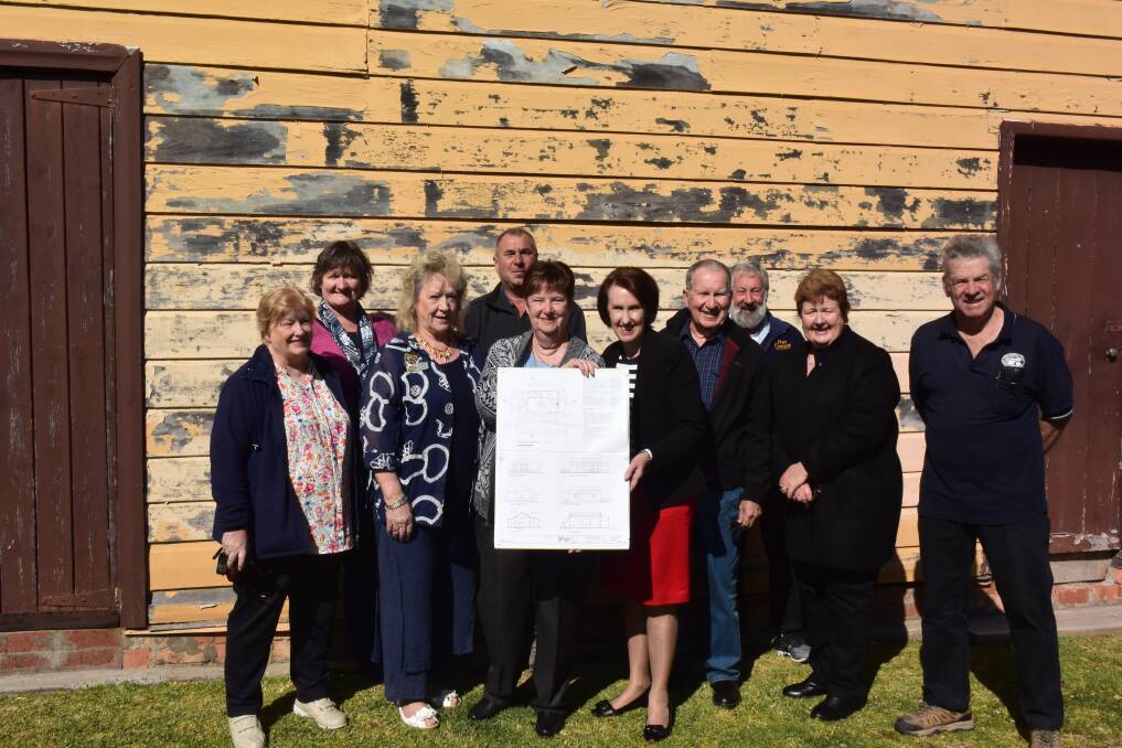 Funding boost: Mid North Coast Maritime Museum representatives Miriam Johnson, Cathy Stevens, Linda Turner, Tony Stevens, Jan Howison, Port Macquarie MP Leslie Williams, Ted Kasehagen, Peter Robinson, Helen Carruthers and Ron Window with the proposed floor plan for the Investigator Building renovation.