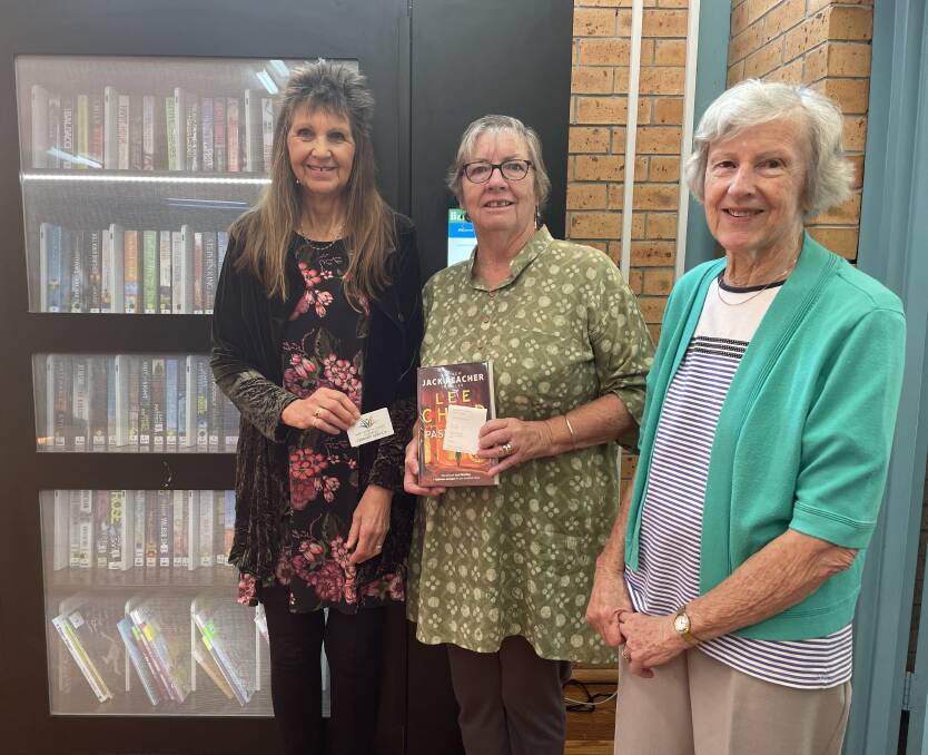 Cathie Craft members Jey Ridgewell, Sandra Tobin and Jean Beck are happy about the introduction of the library kiosk.