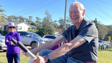 Bonny Hills Progress Association committee member Ian Simpson puts the outdoor gym equipment to the test. Photo: Lisa Tisdell