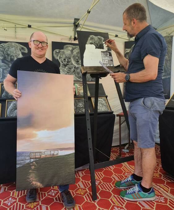 Creative flair: Photographer Rich Shaw and artist David Brooker showcase their work at the artists' market in Port Macquarie as part of ArtWalk.