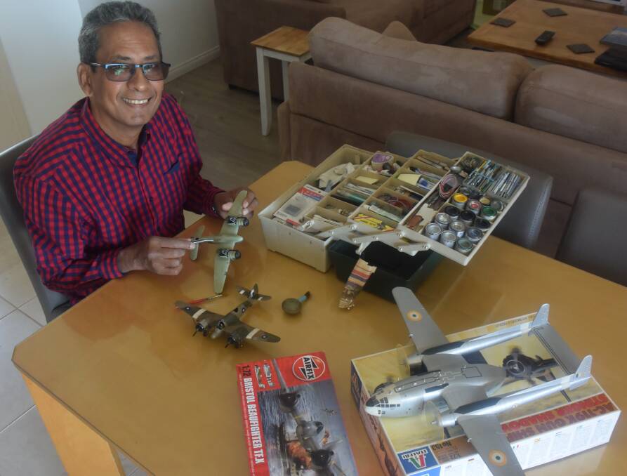 Precise craft: Scale model enthusiast David Connolly works on his latest project.