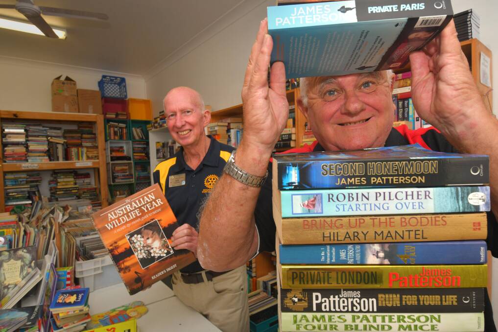 Helping hand: Rotary Club of Port Macquarie's Bob Cleland and Phil Perry support the second hand book store. All sales income from the books throughout October will be donated to Rotary’s farmer support programs.