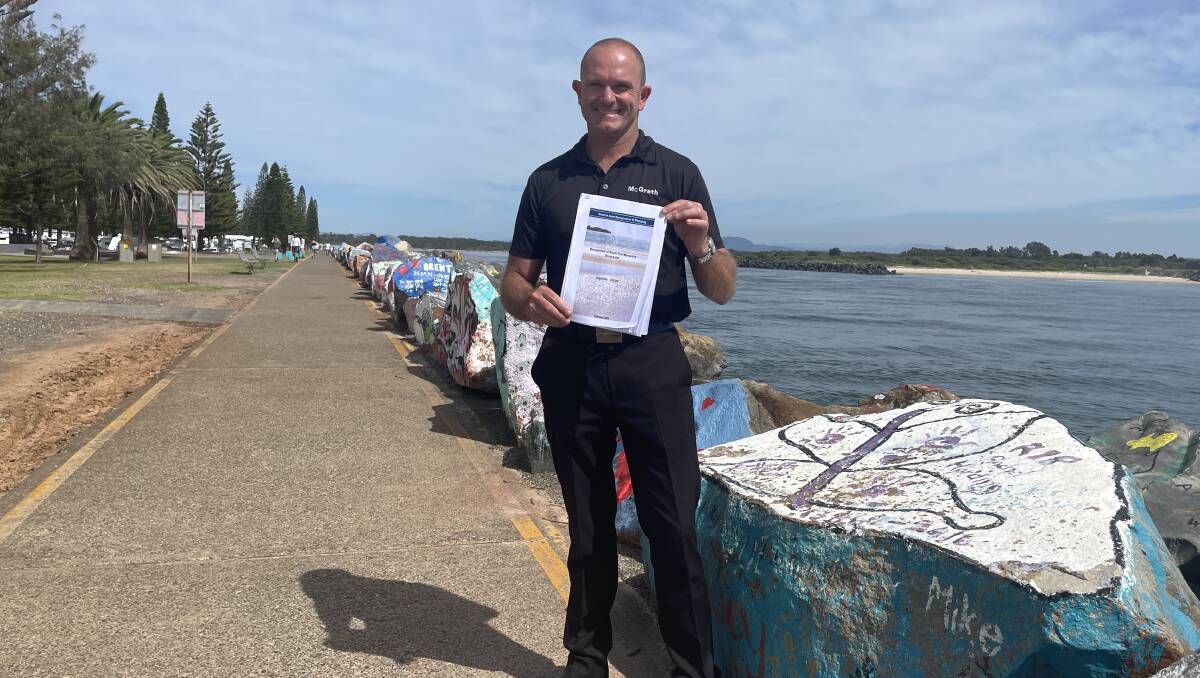 Save Our Breakwall spokesperson Damian King holds a copy of the Port Macquarie Southern Breakwall assessment report. Picture by Lisa Tisdell