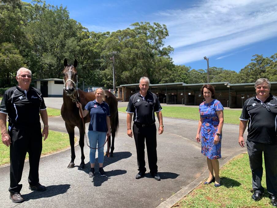 Funding boost: Wayne Evans, "Kenny" with handler Lara Scorse, David Todd, Port Macquarie MP Leslie Williams and Michael Bowman look forward to the improvement project at Port Macquarie Racecourse.
