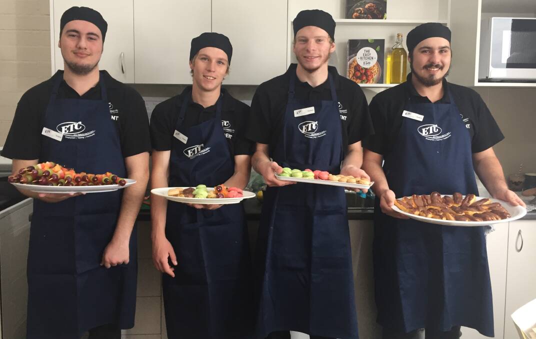 Experiential learning: Certificate three hospitality students Bryce Cordell, Jordon Mayer, Aaron Horsley and Kyren Butcher support the centre's official opening.