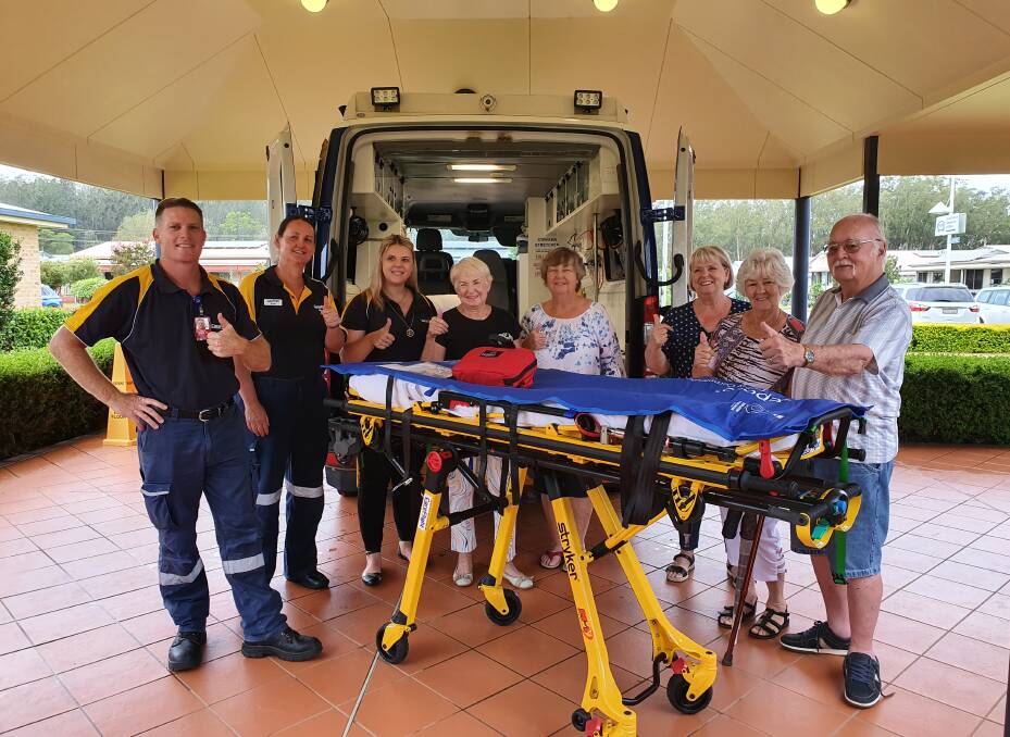Thank you: CareFlight representatives Leif O'Brien, Kylie Osborn and Skye Sharpe and Dahlsford Grove Lifestyle Village craft fair committee members Dian Barnes, Pauline Grant, Jean Dodd, Lyn Reynolds and John Reynolds give the thumbs up to the donation.