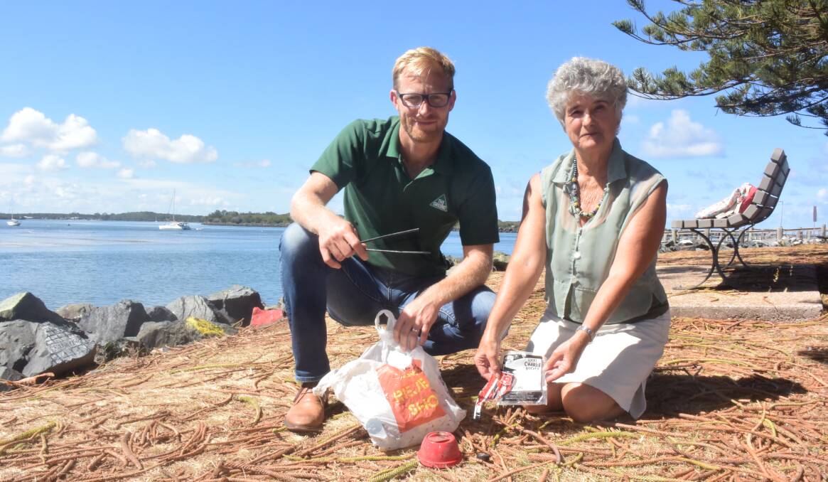 Call for action: NSW Greens MLC and healthy oceans spokesperson Justin Field and The Greens candidate for Port Macquarie Drusi Megget clean up plastic waste on the Town Green.