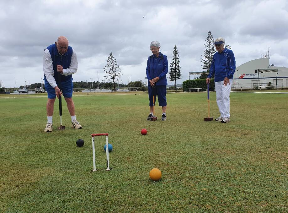 Game of skill: Port Macquarie Croquet Club members Frank Urban, Janet Fischer and Olive Bowly put their croquet skills to the test.
