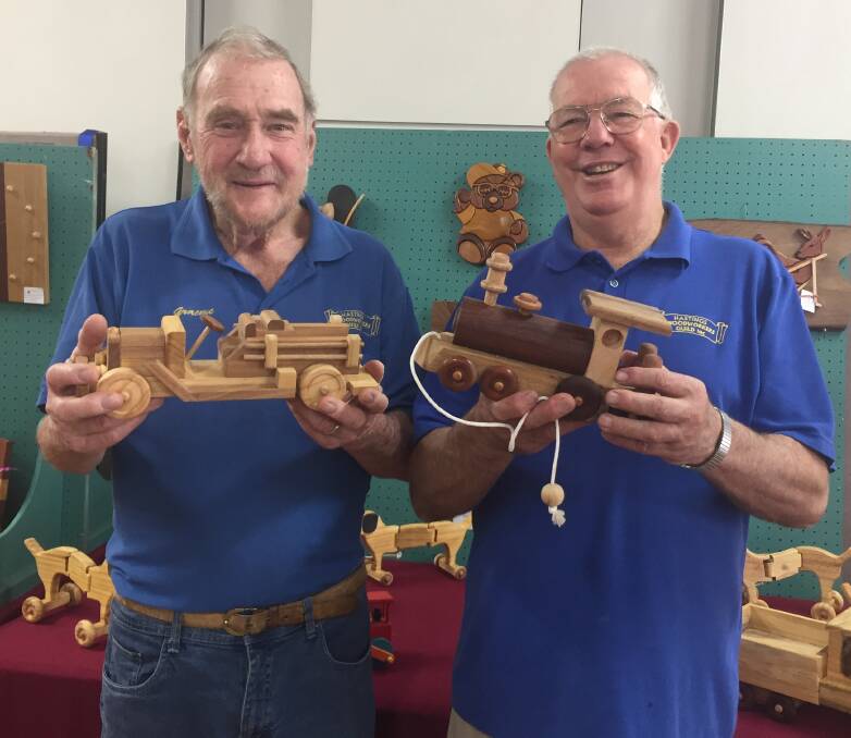 Helping others: Hastings Woodworkers Guild president Graeme Ditchburn and member Robert Miles display some of the handcrafted toys to be donated.