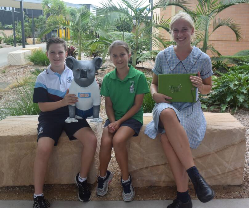 Koala preservation: St Columba Anglican School students Adam Hempsell, Zali Rose and Matilda Lindeman    support the Koala Smart program.