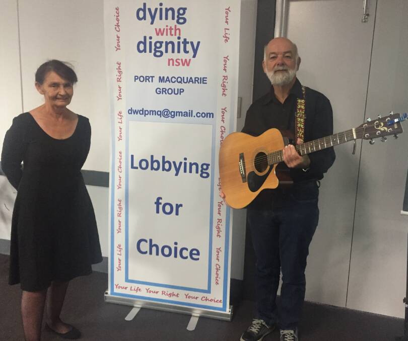 Breaking down barriers: Susan Murphy and Graeme Atkins prepare to present to the Mid-North Coast Dying with Dignity NSW meeting.