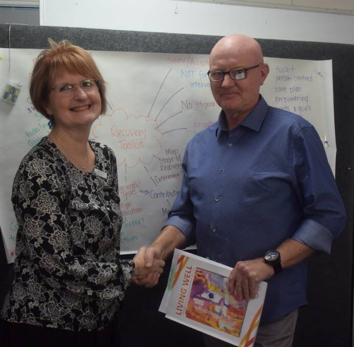 Consultation process: NSW Mental Health Commissioner Catherine Lourey is welcomed to Endeavour Mental Health Recovery Clubhouse by the clubhouse's CEO Rob Moorehead.