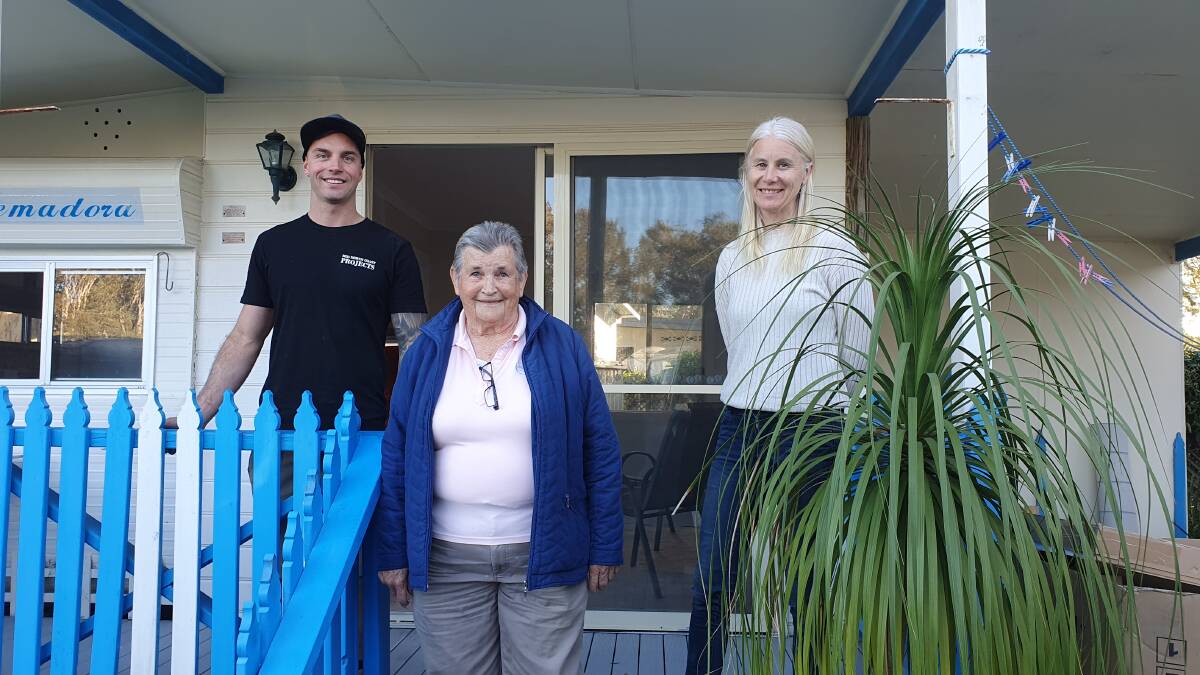Many thanks: Brigadoon Holiday Park resident Margaret Patrick (centre), handyman Aidan Stephens and St Agnes' Parish recovery support worker Nette McCoubrie are thrilled with the rebuild to the cabin.