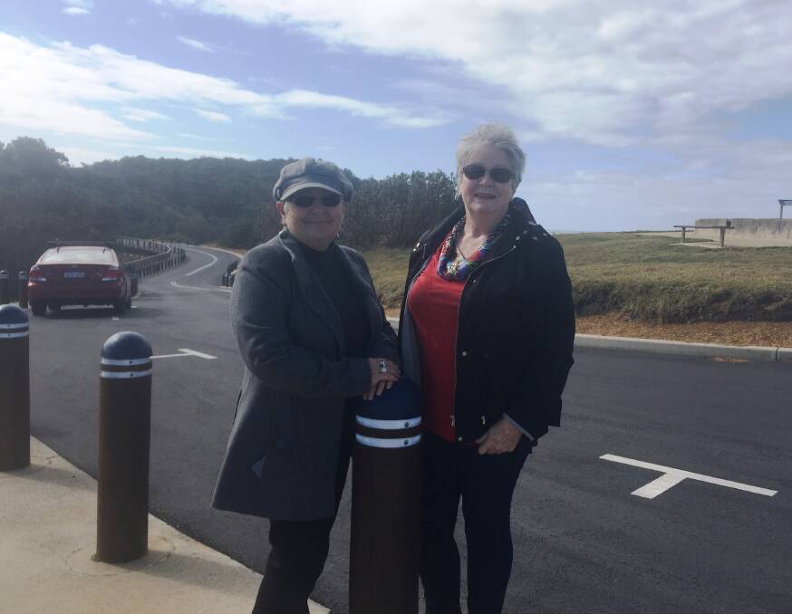 Location, location, location: Resident Sue Hewes and visitor Helen Wright give the thumbs up to the Lighthouse Road east improvements.