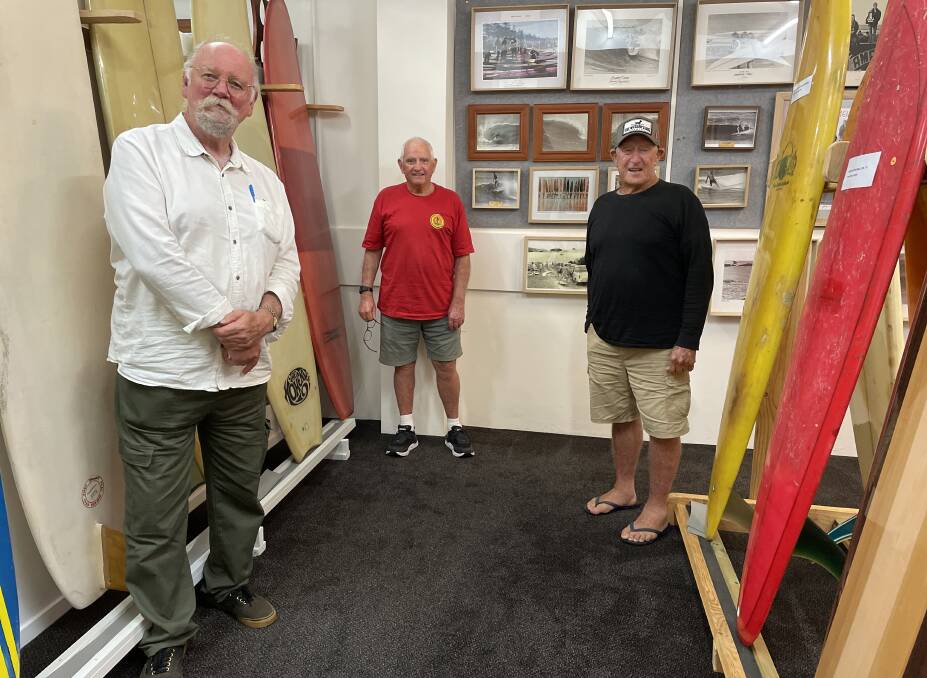  Port Macquarie Surfing History Association vice-president Glenn Dick, association member Jim Pullen and Port Macquarie Surfing Museum project ambassador for surfing Ken Williams promote the pop-up shop and museum project.