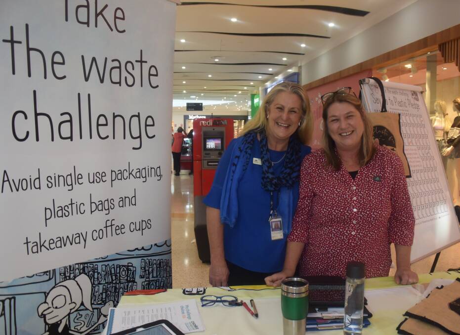 Reduce waste: Janene Sheehan and Helen Payne from Port Macquarie-Hastings Council promote Plastic Free July at a pop-up stall at Settlement City.