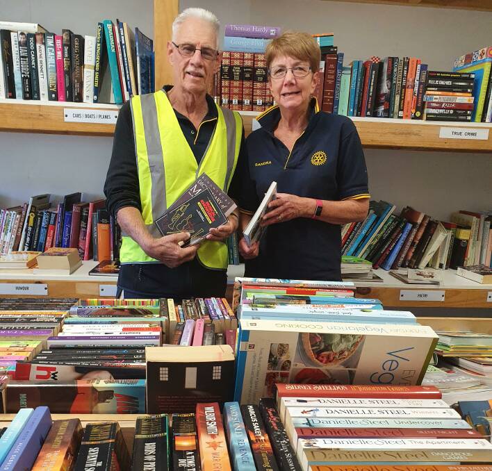 Fundraiser: Rotary Club of Port Macquarie members Ian Cropper and Sandra Adams volunteer at the pre-loved book store.