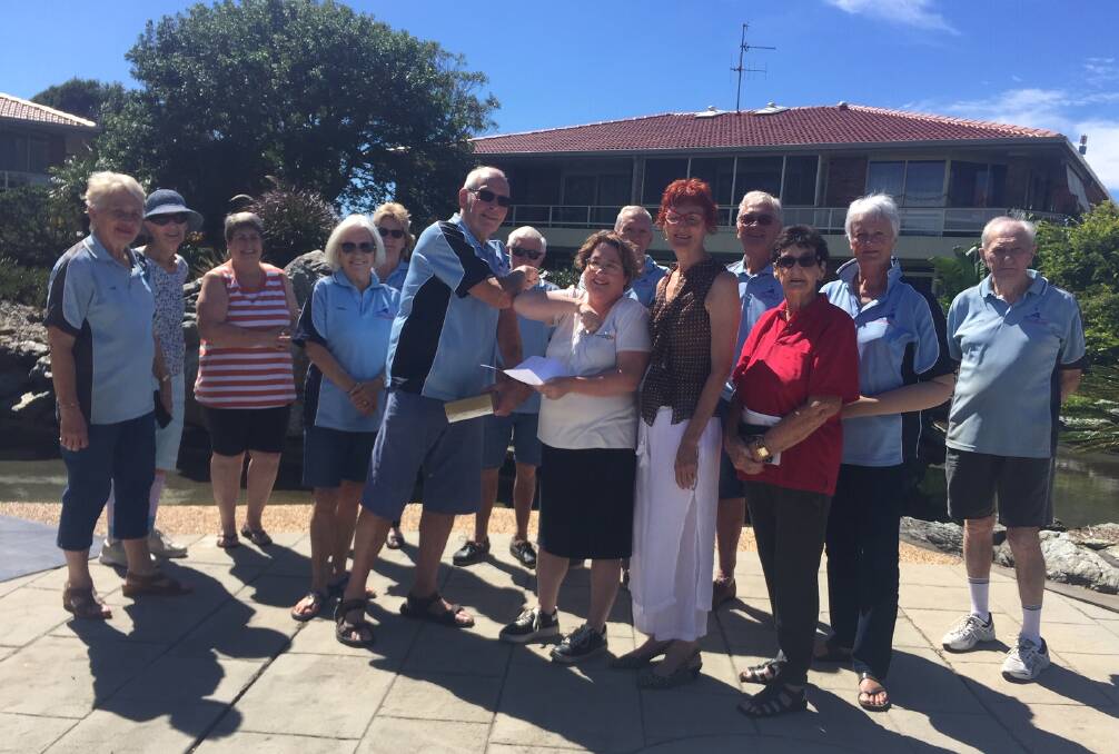 Much appreciated: Sailability Port Macquarie president Bob Walsh thanks Governor's Retirement Resort assistant manager Julia Peterson for the donation as supporters look on.