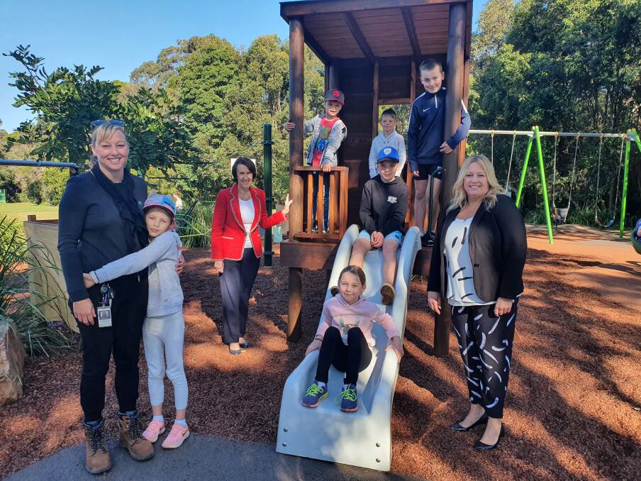 Popular playground: Project officer Lucy Kowalewski, Port Macquarie MP Leslie Williams and mayor Peta Pinson look on as children enjoy the upgraded Blair Reserve playground.