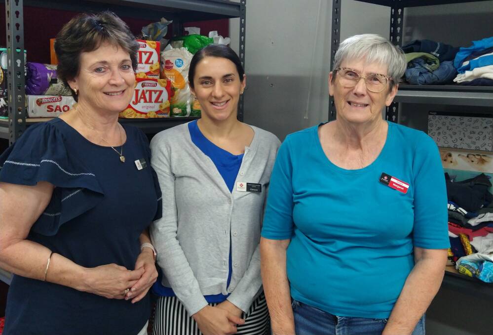 Three volunteers lend a hand at the Pop-Up Pantry.